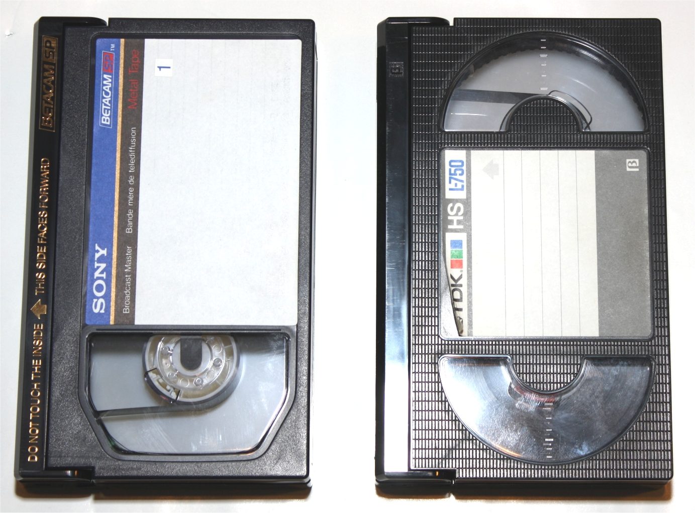 A Sony Betacam SP deck with a stack of Betacam cassettes beside it